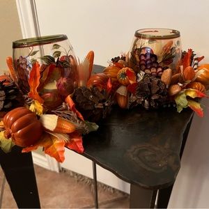 Two. Candles/votive with fall candle rings.